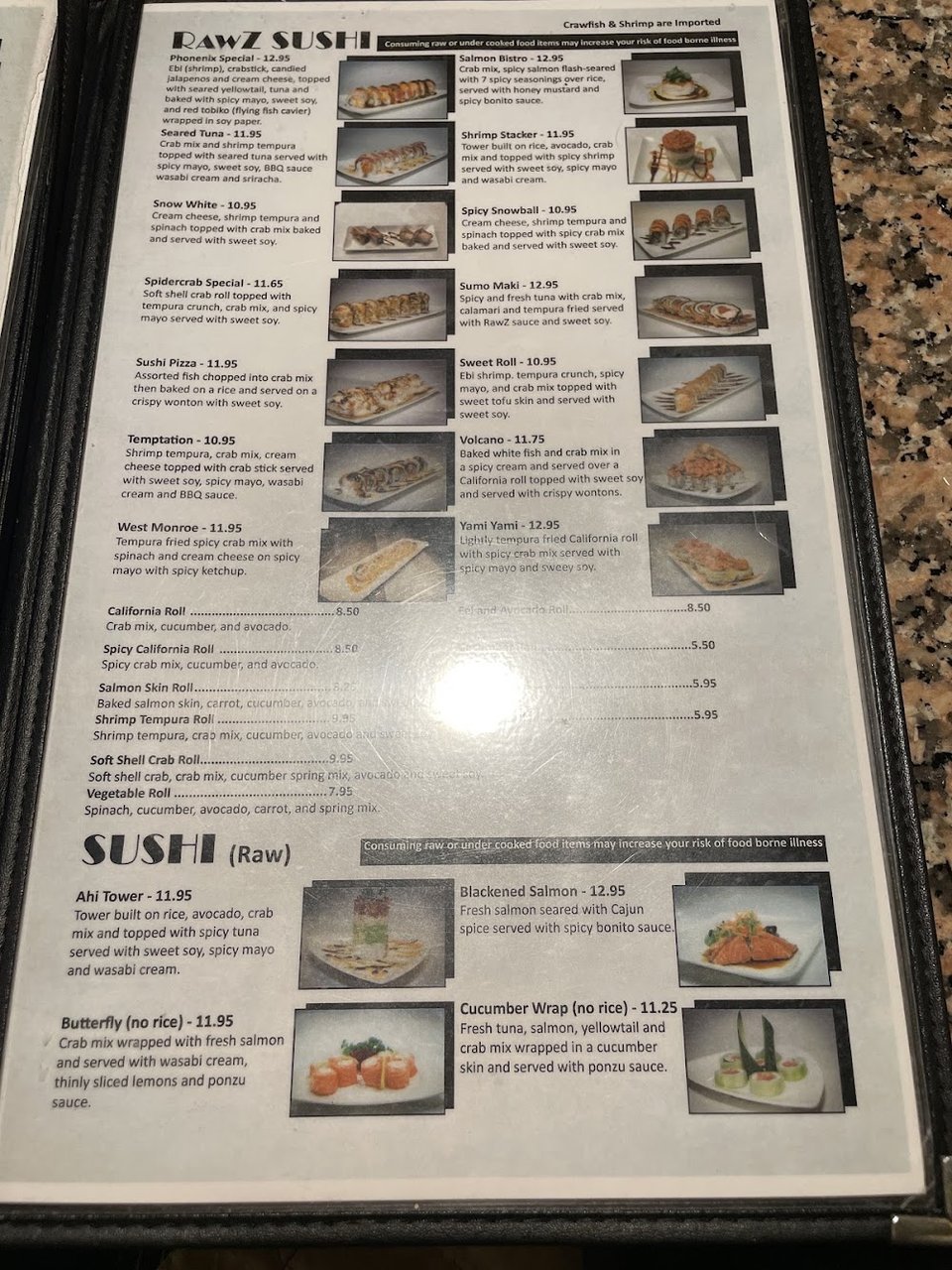 Printed dishes list beside boba tea.